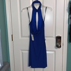 BeBe Brand New. Tags still attached. Halter style. Low back. Back zipper.